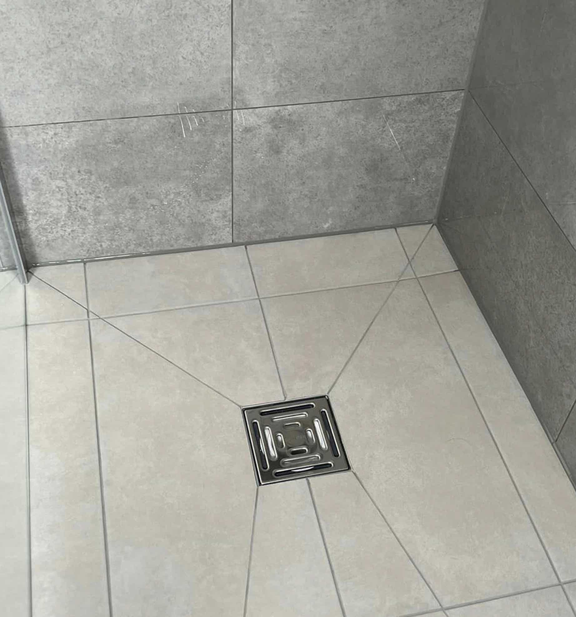 Photo of luxury wet room shower area floor installed by Plumb Yorkshire Ltd.