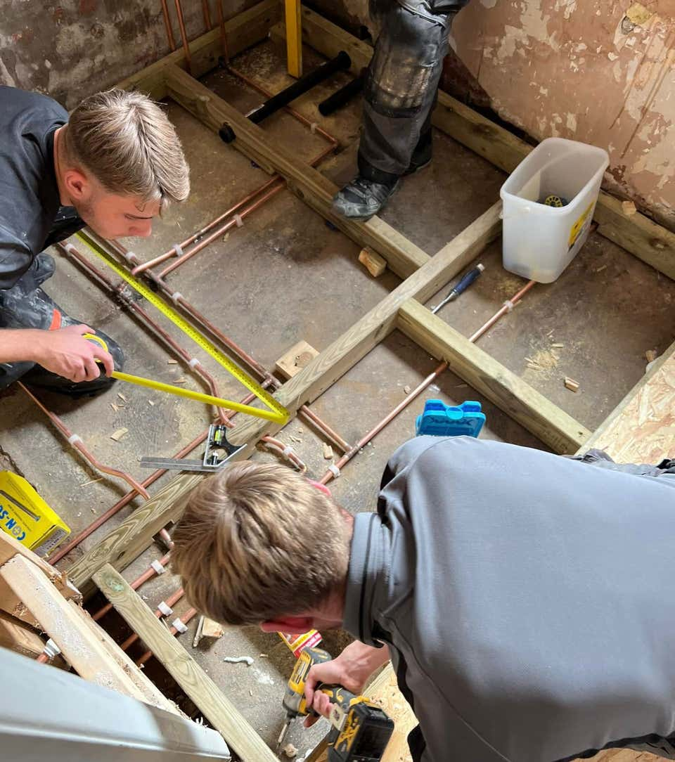 Image of Plumb Yorkshire Ltd. accredited workmen on a bathroom installation.